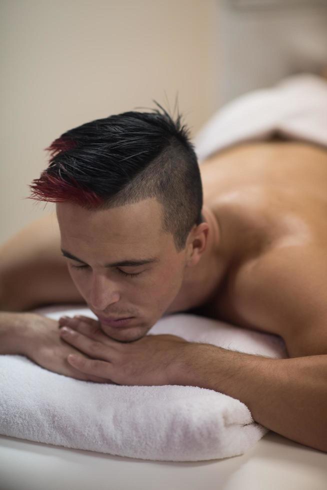 handsome man resting in a spa massage center photo