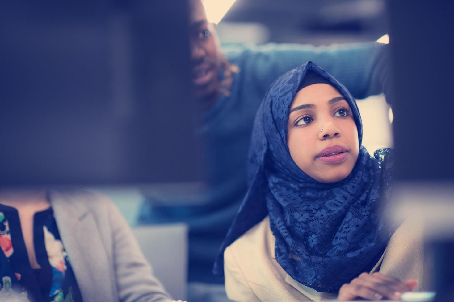 black muslim female software developer at work photo