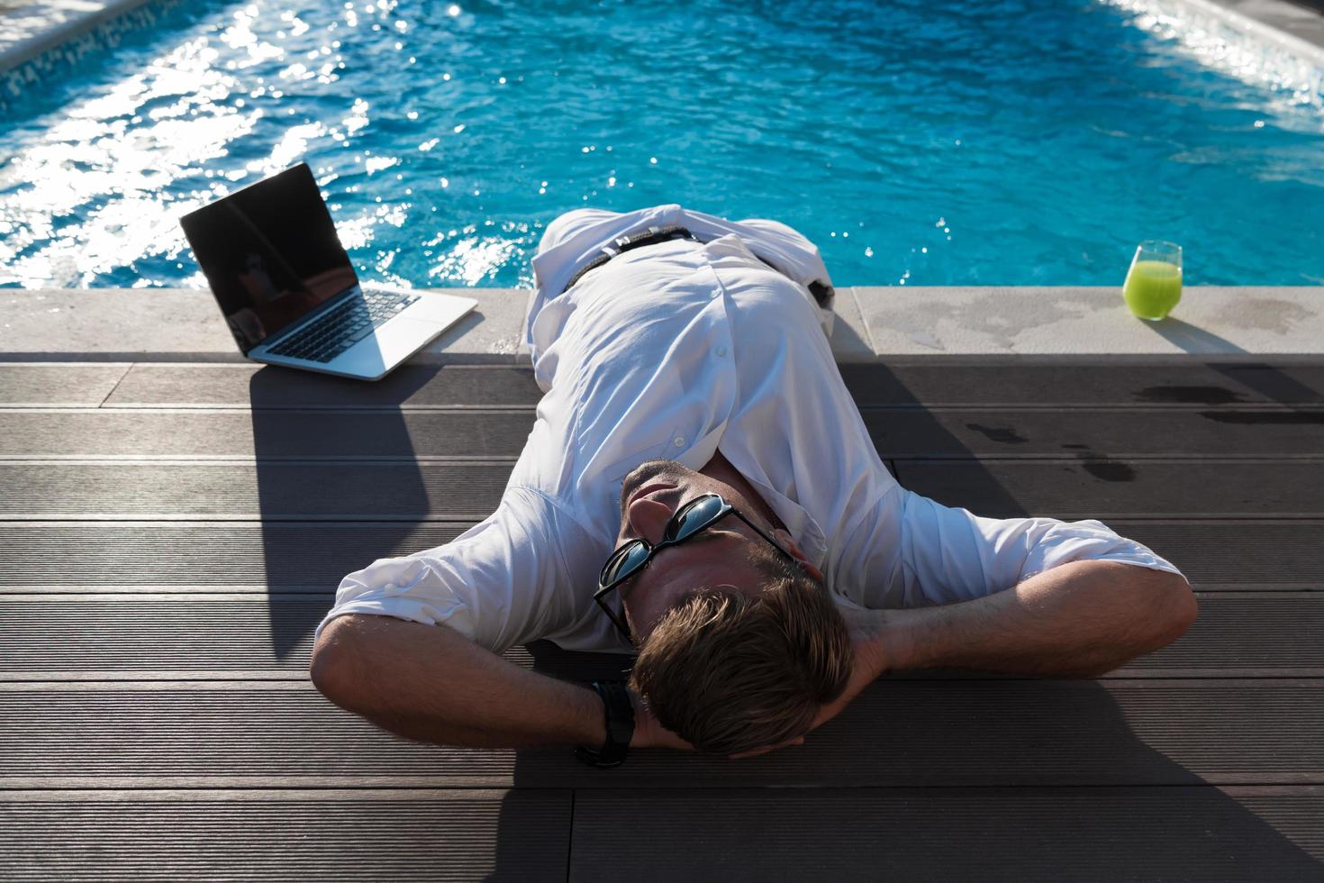 A modern senior man in casual clothes enjoys a vacation in an expensive house. Selective focus photo