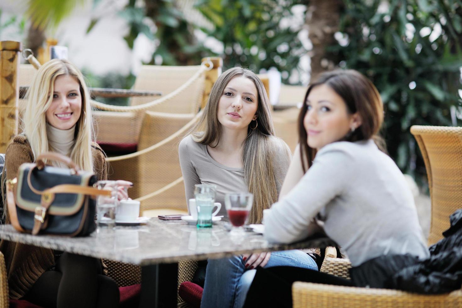 cute smiling women drinking a coffee photo