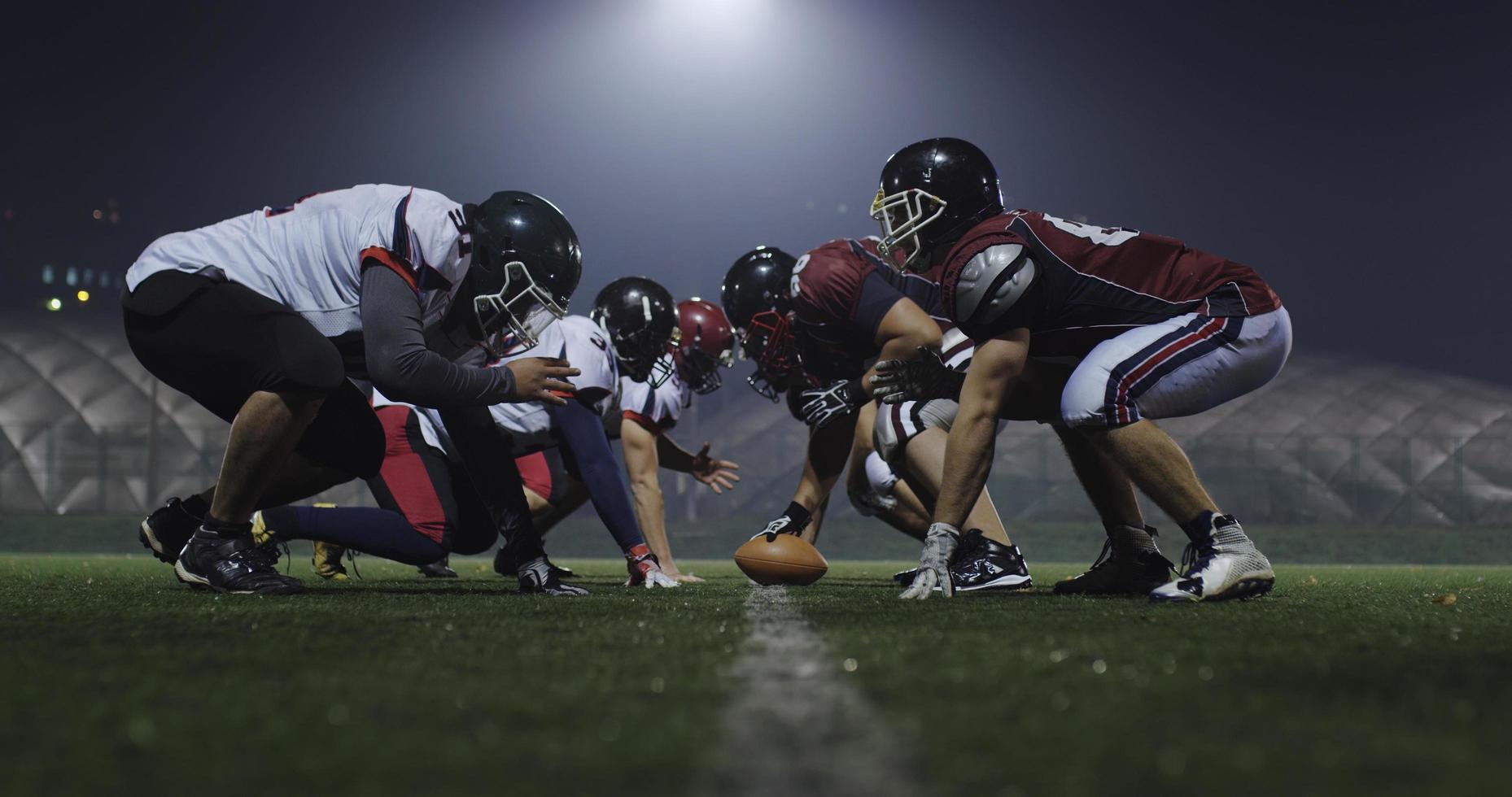 american football players are ready to start photo