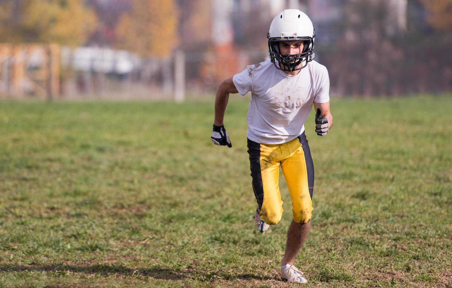 american football player in action photo