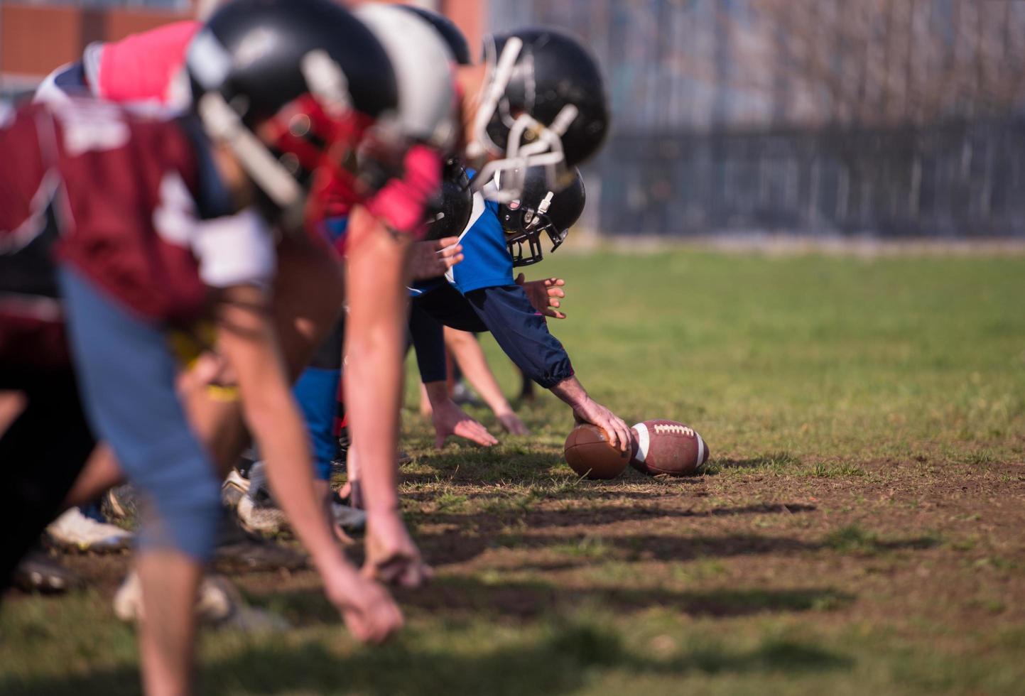 american football team in action photo