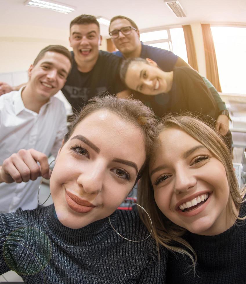 young happy students doing selfie picture photo