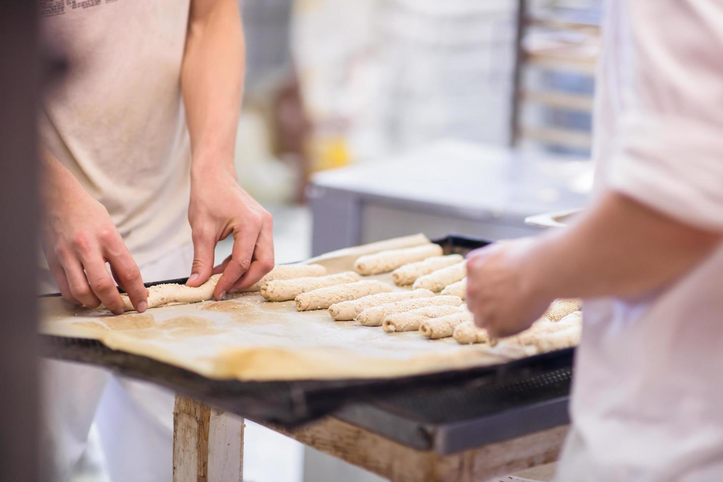 bakers preparing the dough photo