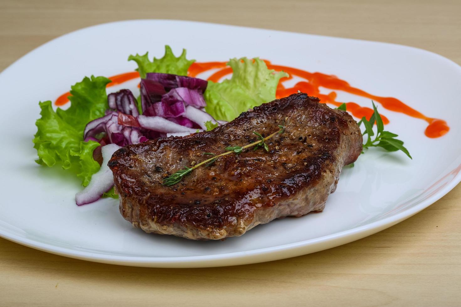Beefsteak on plate photo