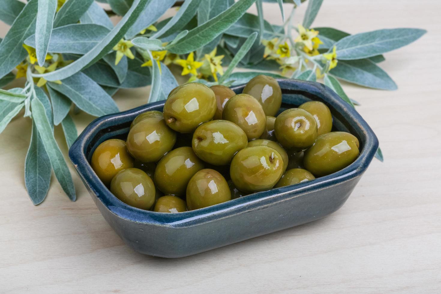 Green olives dish photo