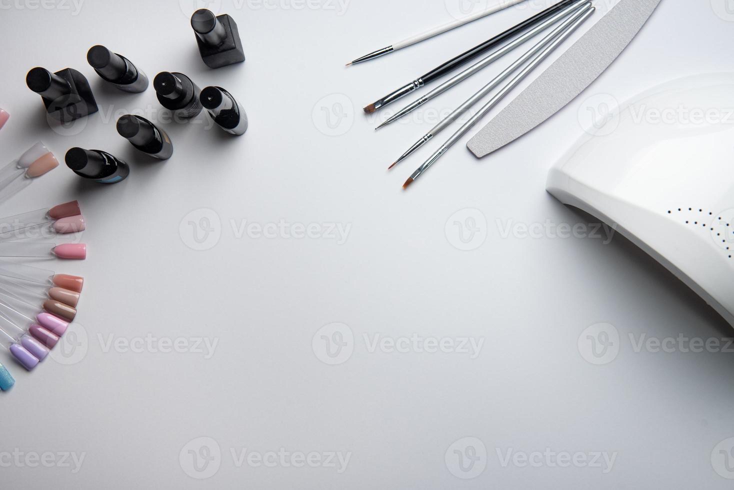 Top view of manicure and pedicure equipment on white background photo