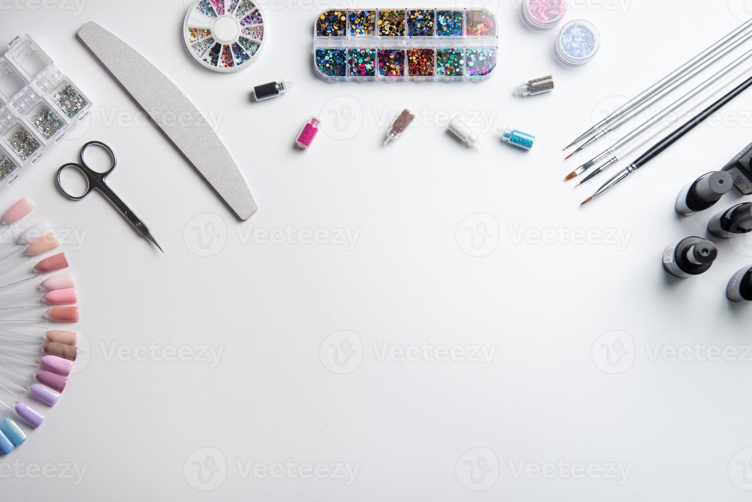 Top view of manicure and pedicure equipment on white background photo