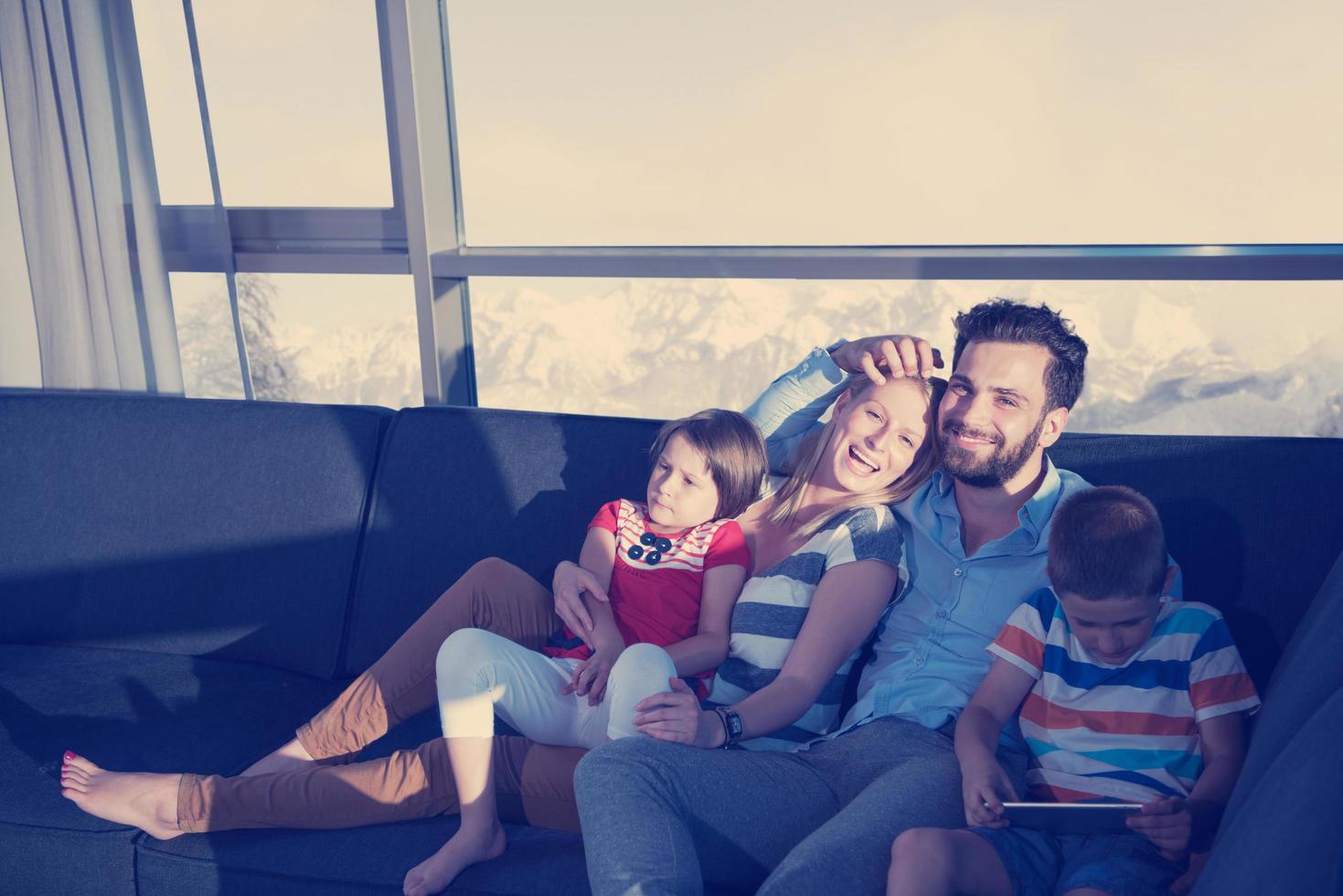happy young couple spending time with kids at home photo