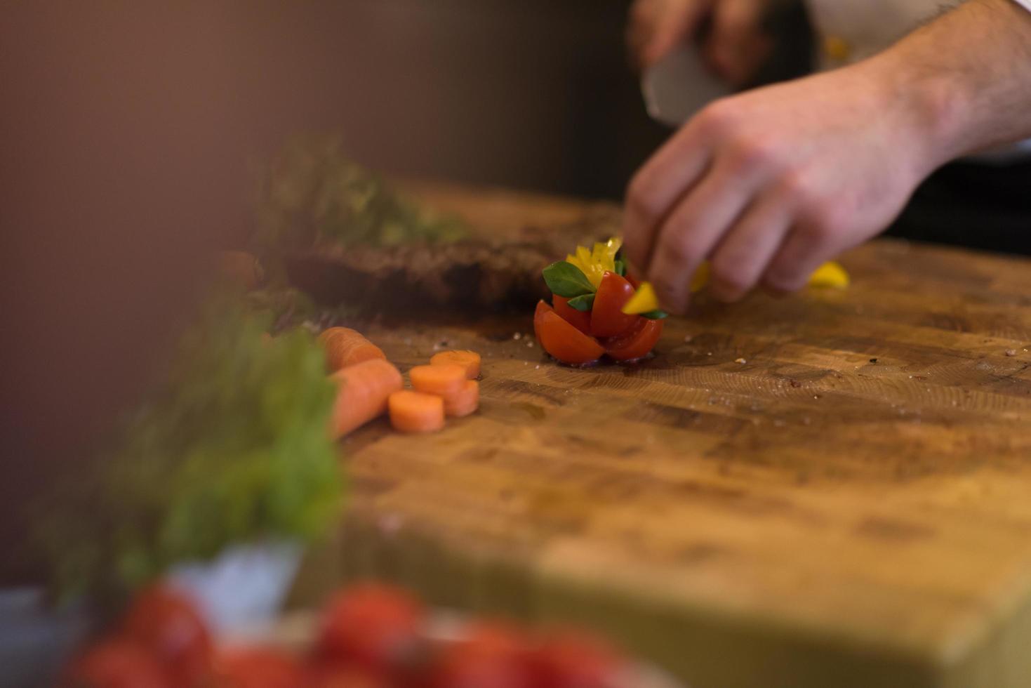 closeup of Chef hands preparing beef steak photo