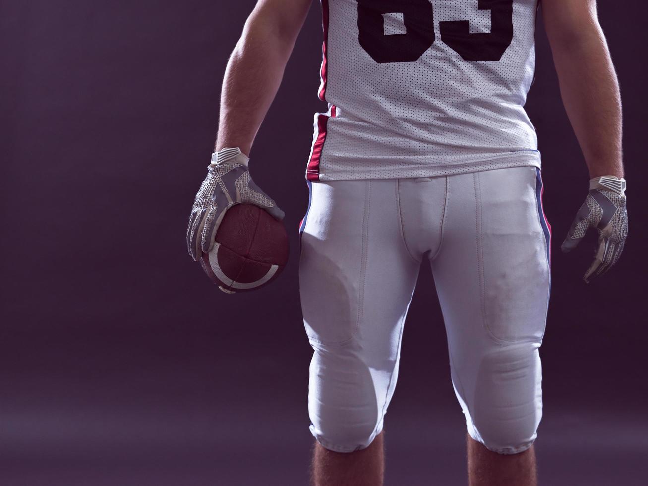 closeup American Football Player isolated on gray photo