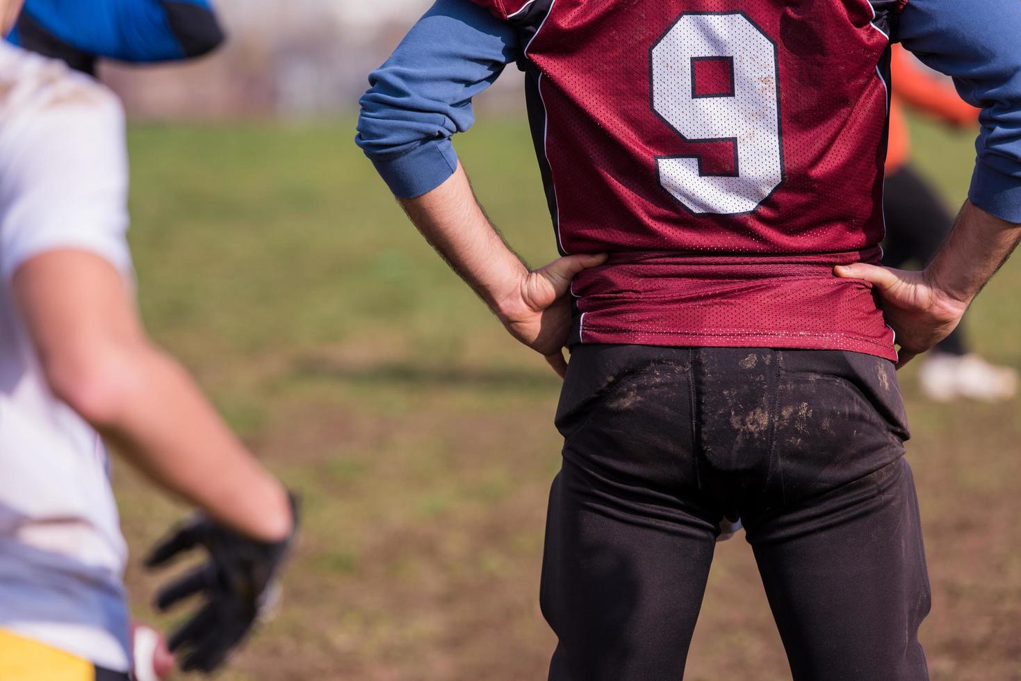 american football team with coach in action photo