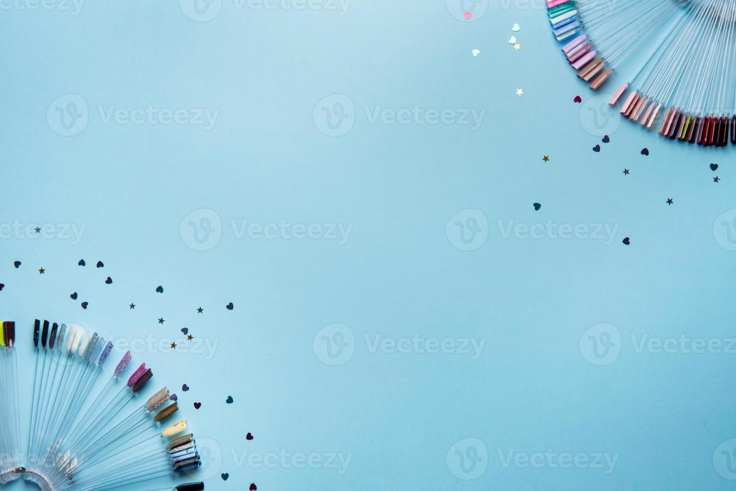 Top view of manicure and pedicure equipment on blue background photo