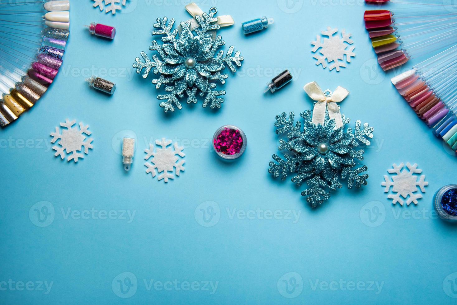 Top view of manicure and pedicure equipment on blue christmas background photo