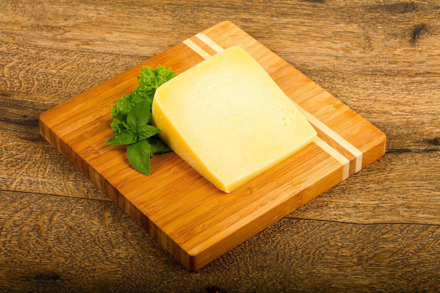 Parmesan cheese on wood photo