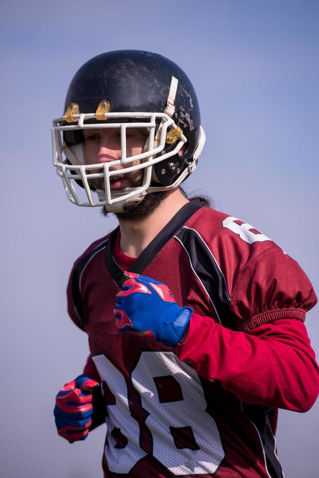 american football player in action photo