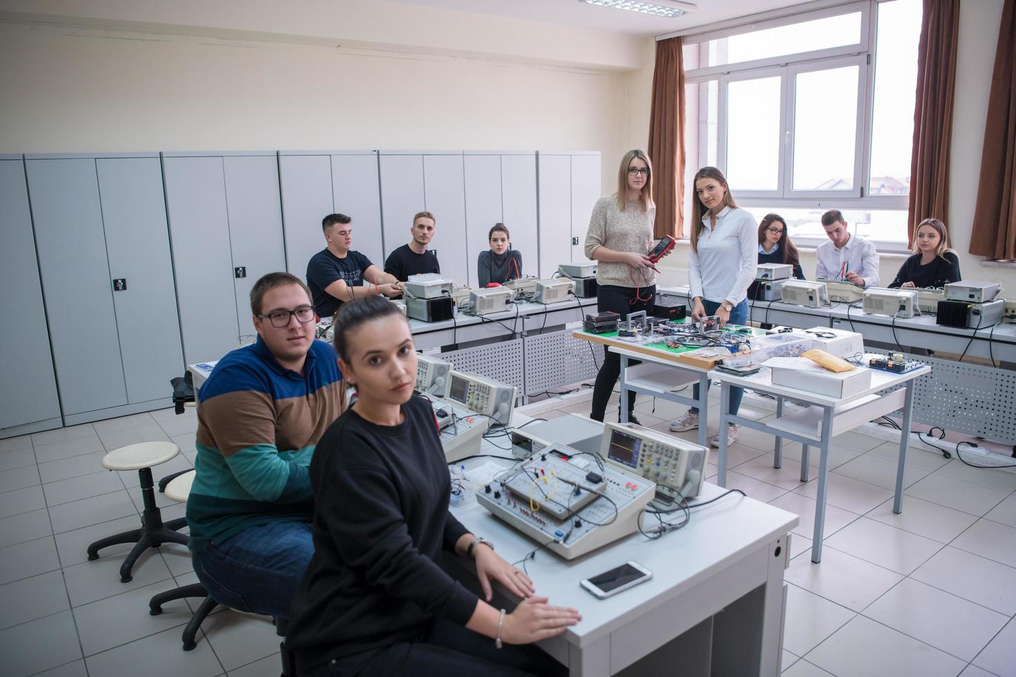 students doing practice in the electronic classroom photo