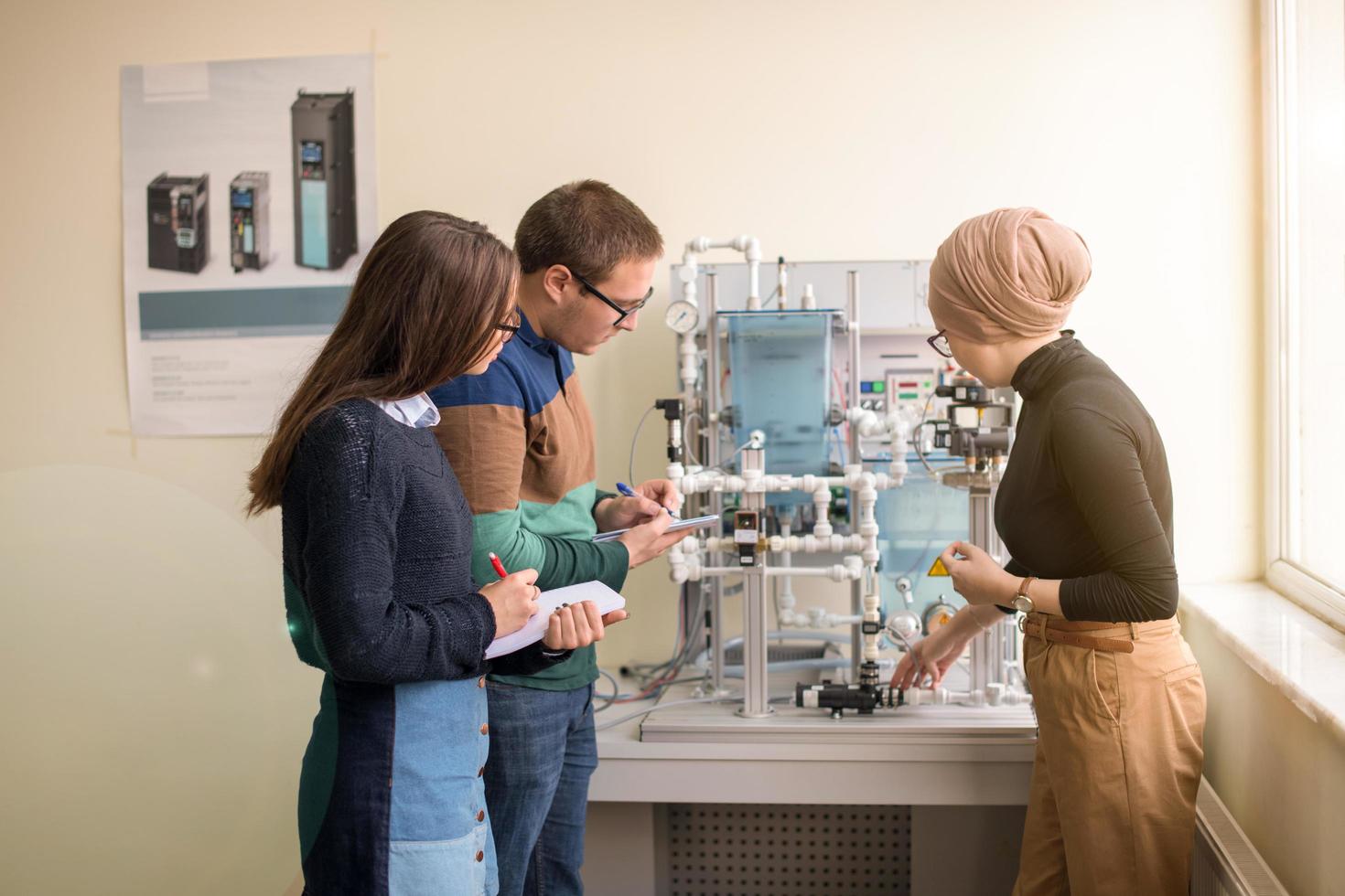 young students doing practice in the electronic classroom photo