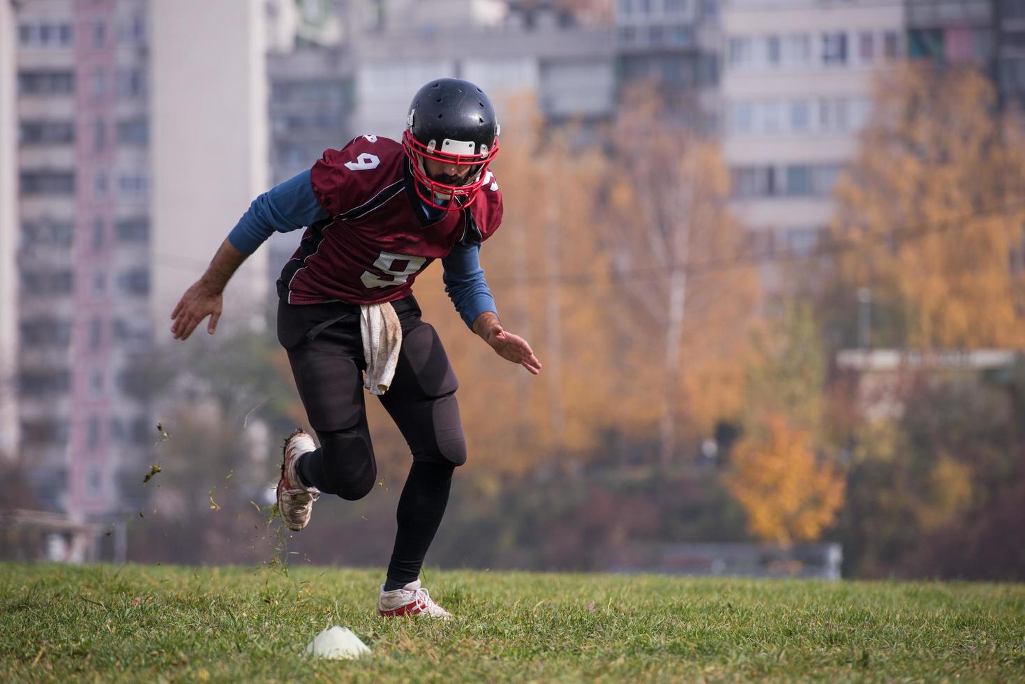 american football player in action photo