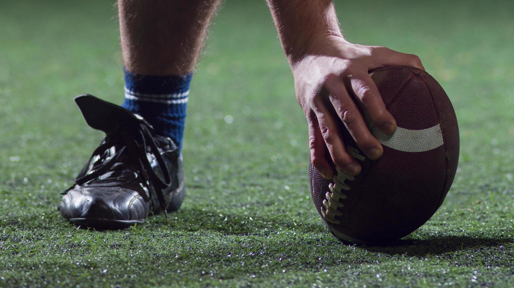 American football player starting football game photo