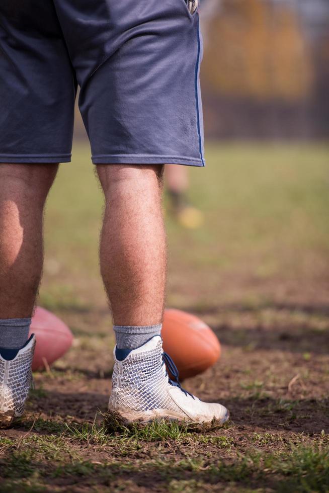 american football kicker practicing kickoff photo