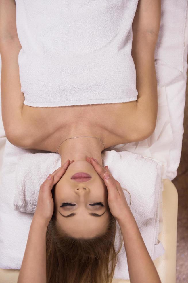 woman receiving a head massage photo