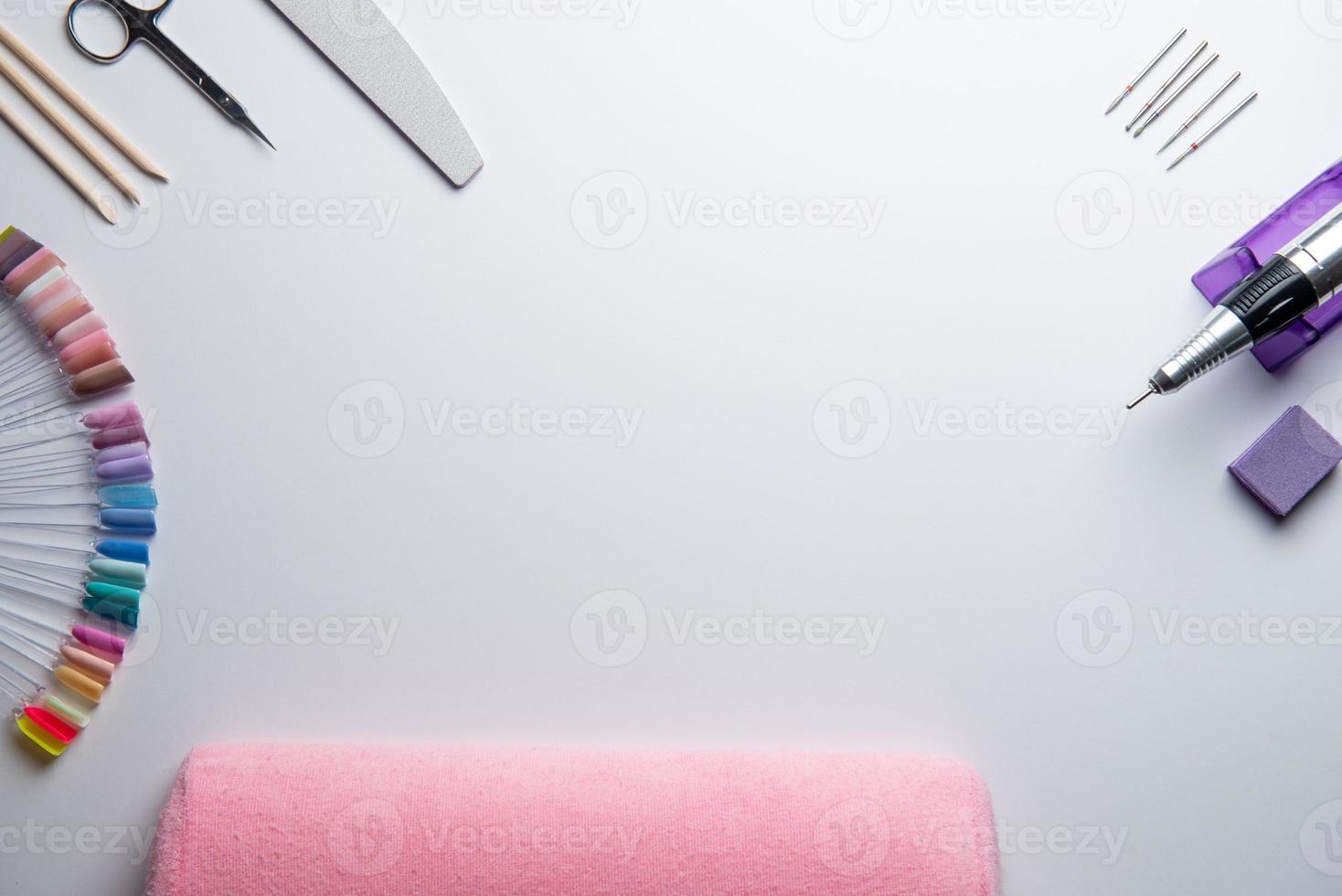 Top view of manicure and pedicure equipment on white background photo