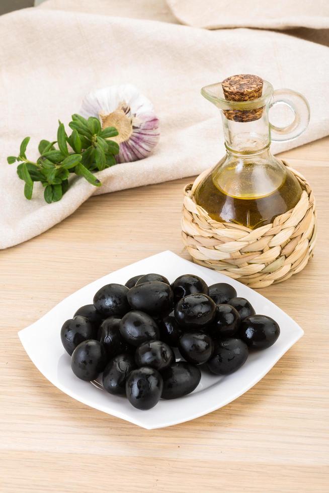 Black olives on plate photo