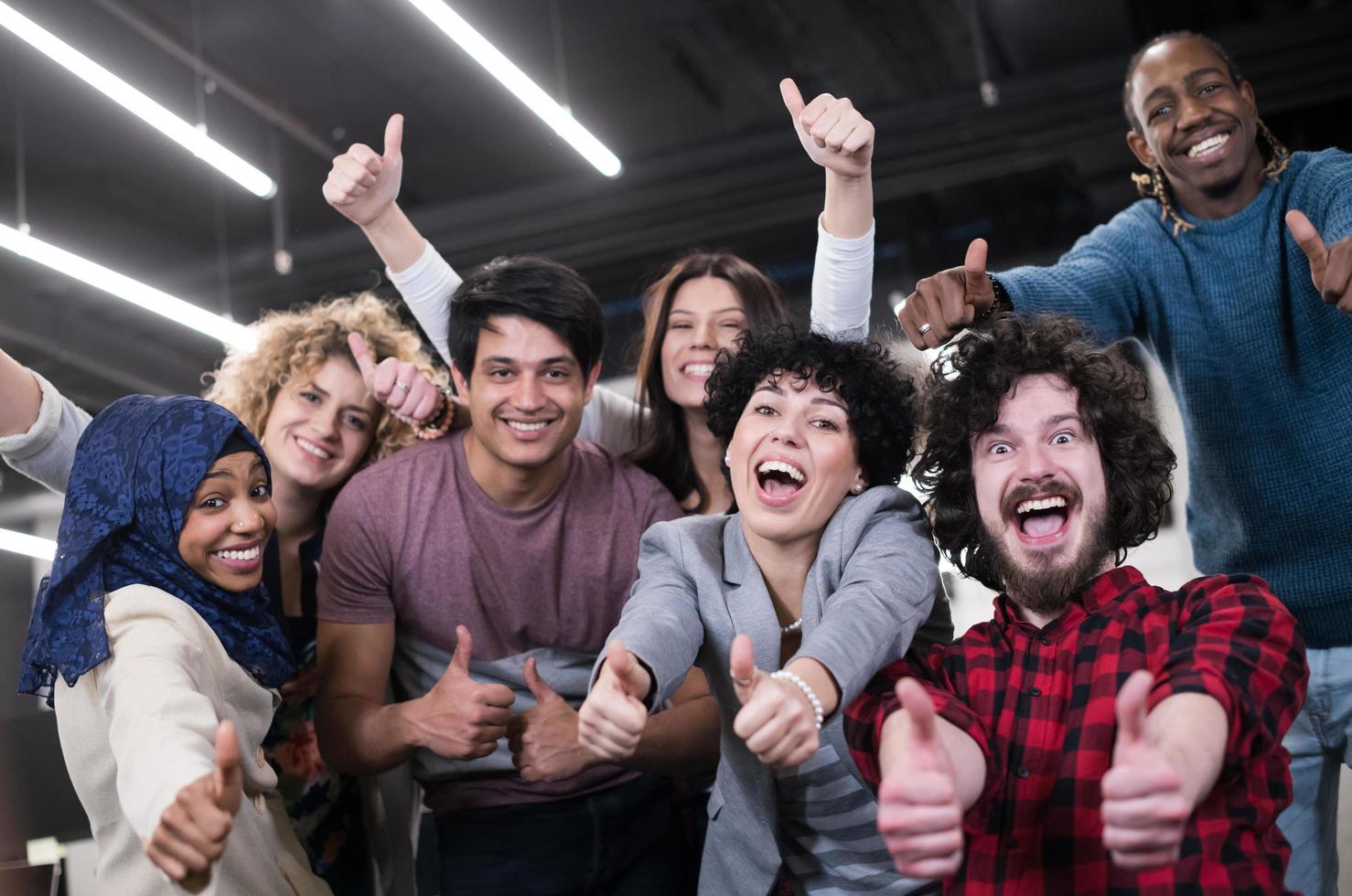 portrait of young excited multiethnics business team photo