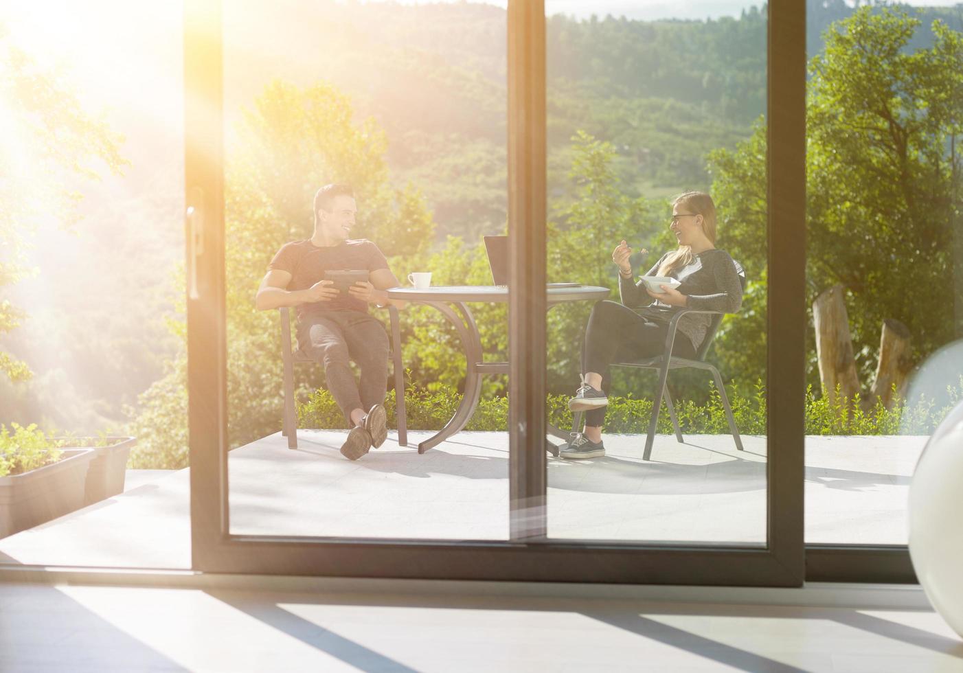 couple enjoying morning coffee and breakfast photo