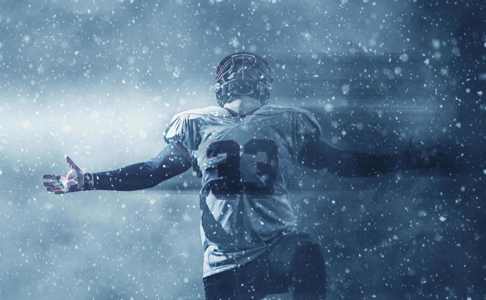 american football player celebrating after scoring a touchdown photo