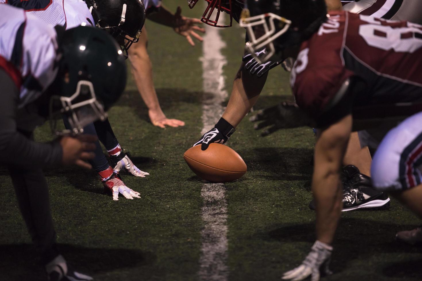 american football players are ready to start photo