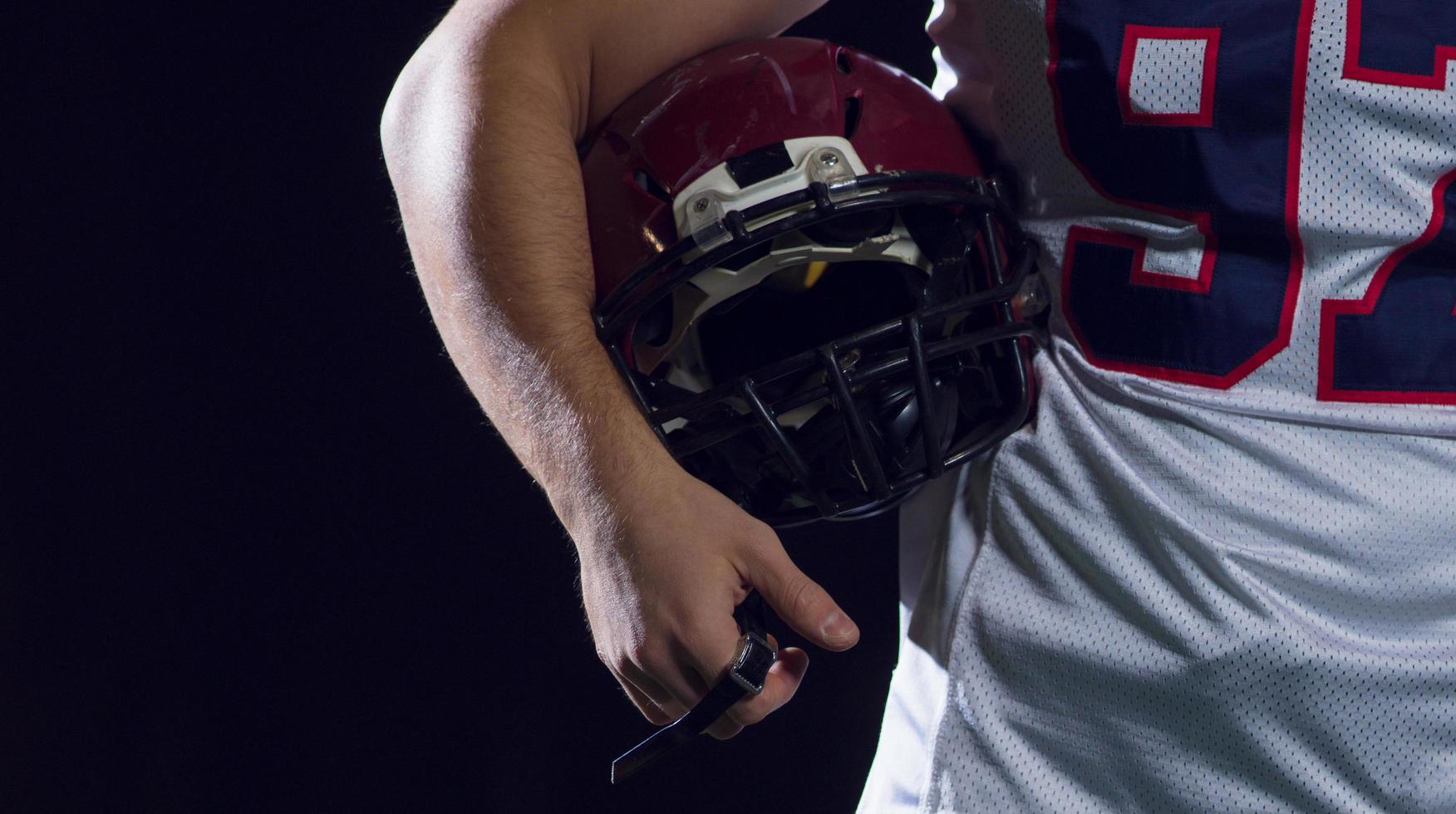 portrait of young confident American football player photo