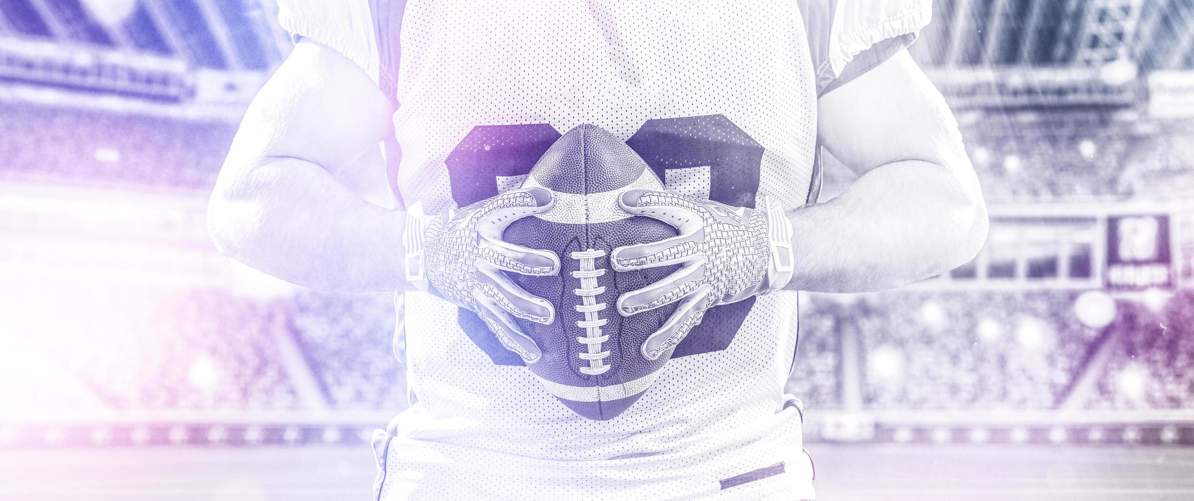 closeup American Football Player isolated on big modern stadium photo
