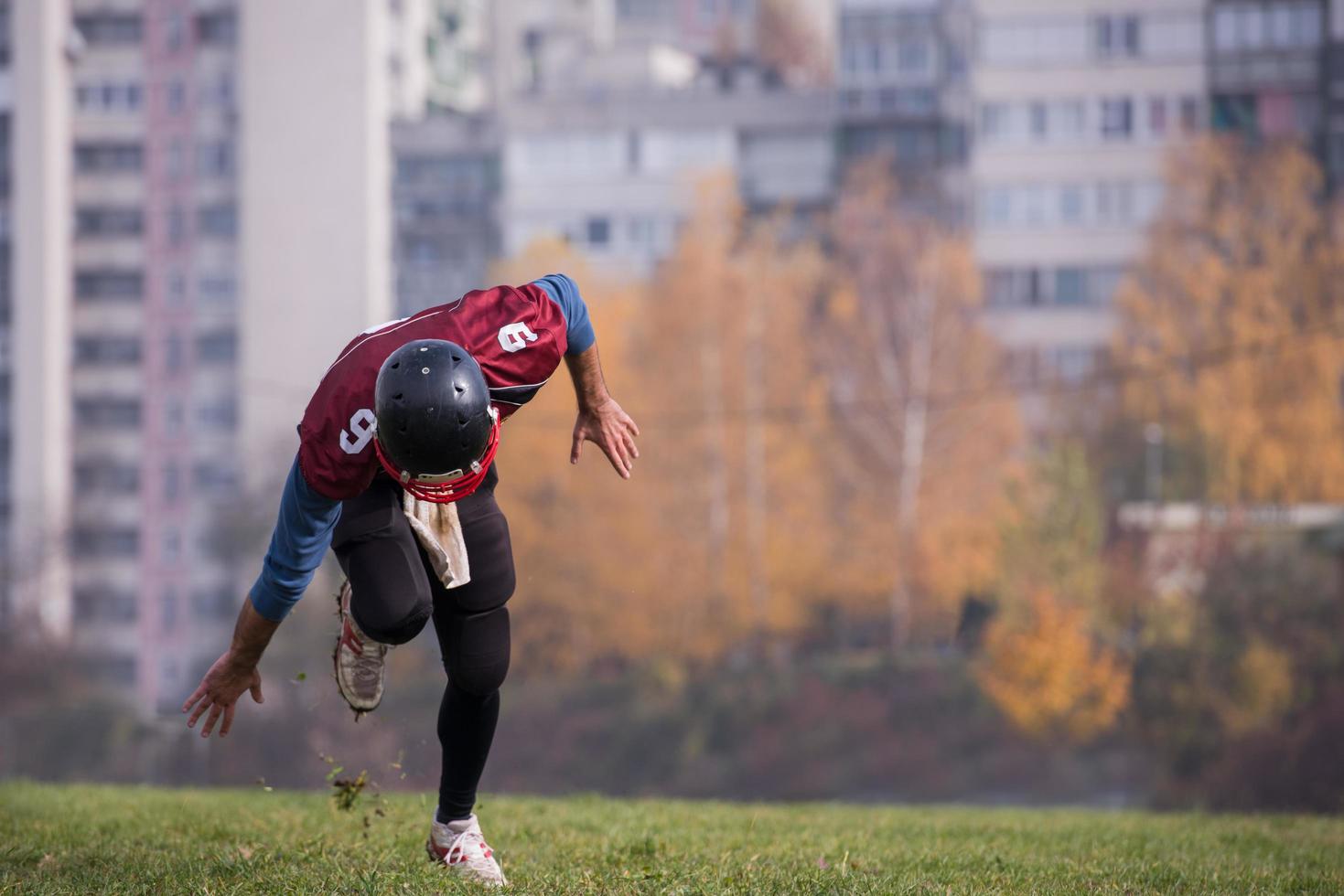 american football player in action photo