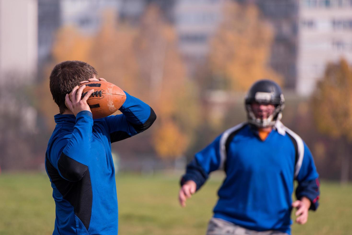 american football team with coach in action photo