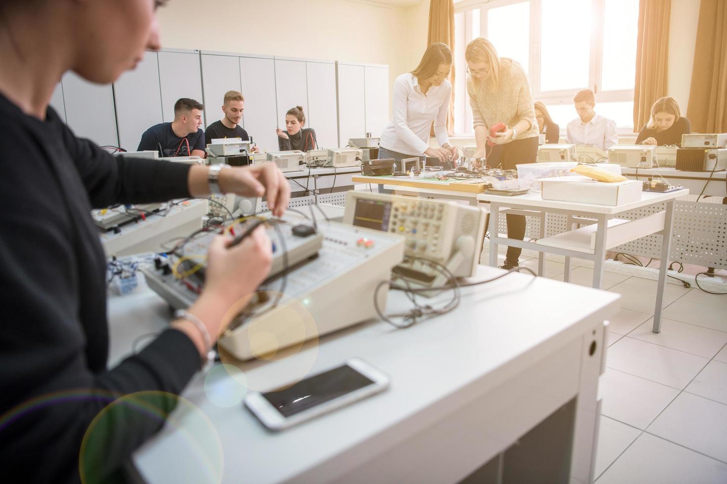 students doing practice in the electronic classroom photo