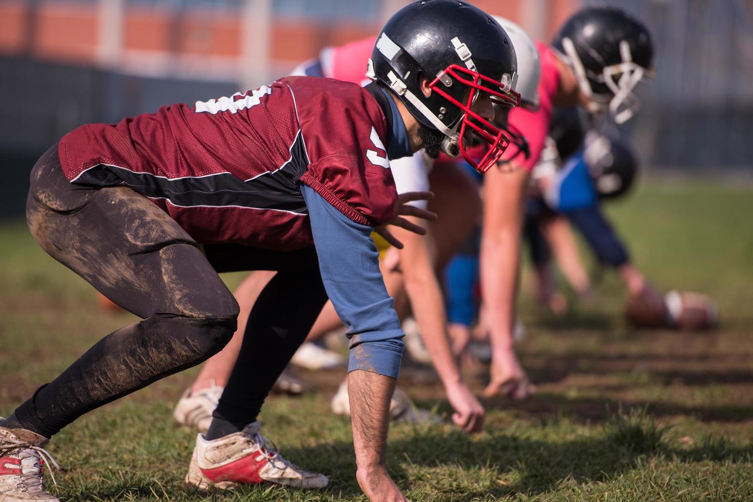 american football team in action photo