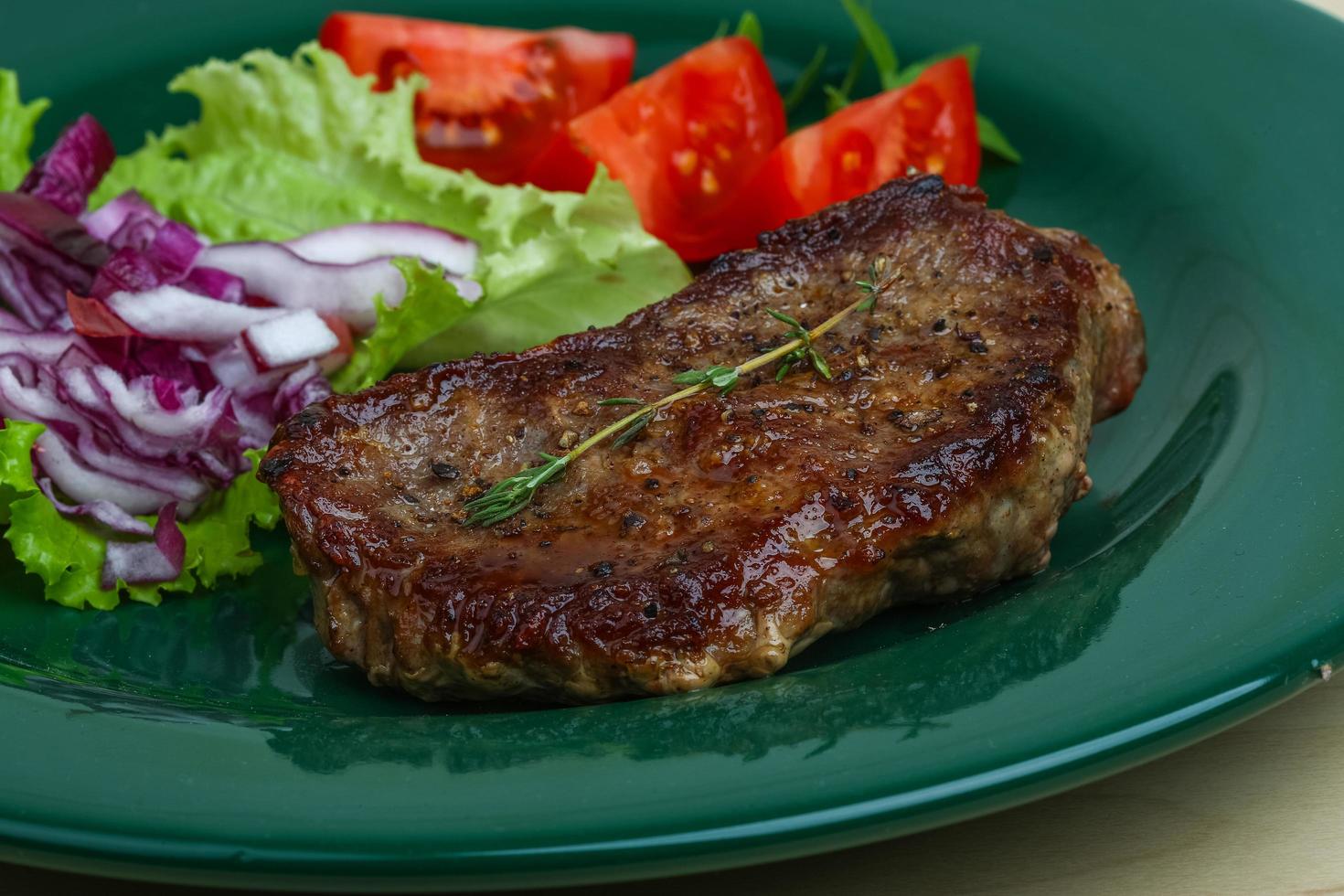 Beefsteak on plate photo