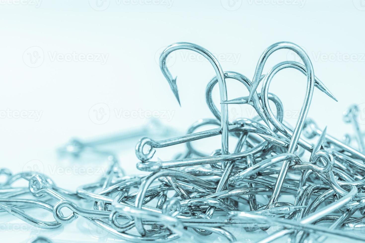 Pile of fish hook on a white photo