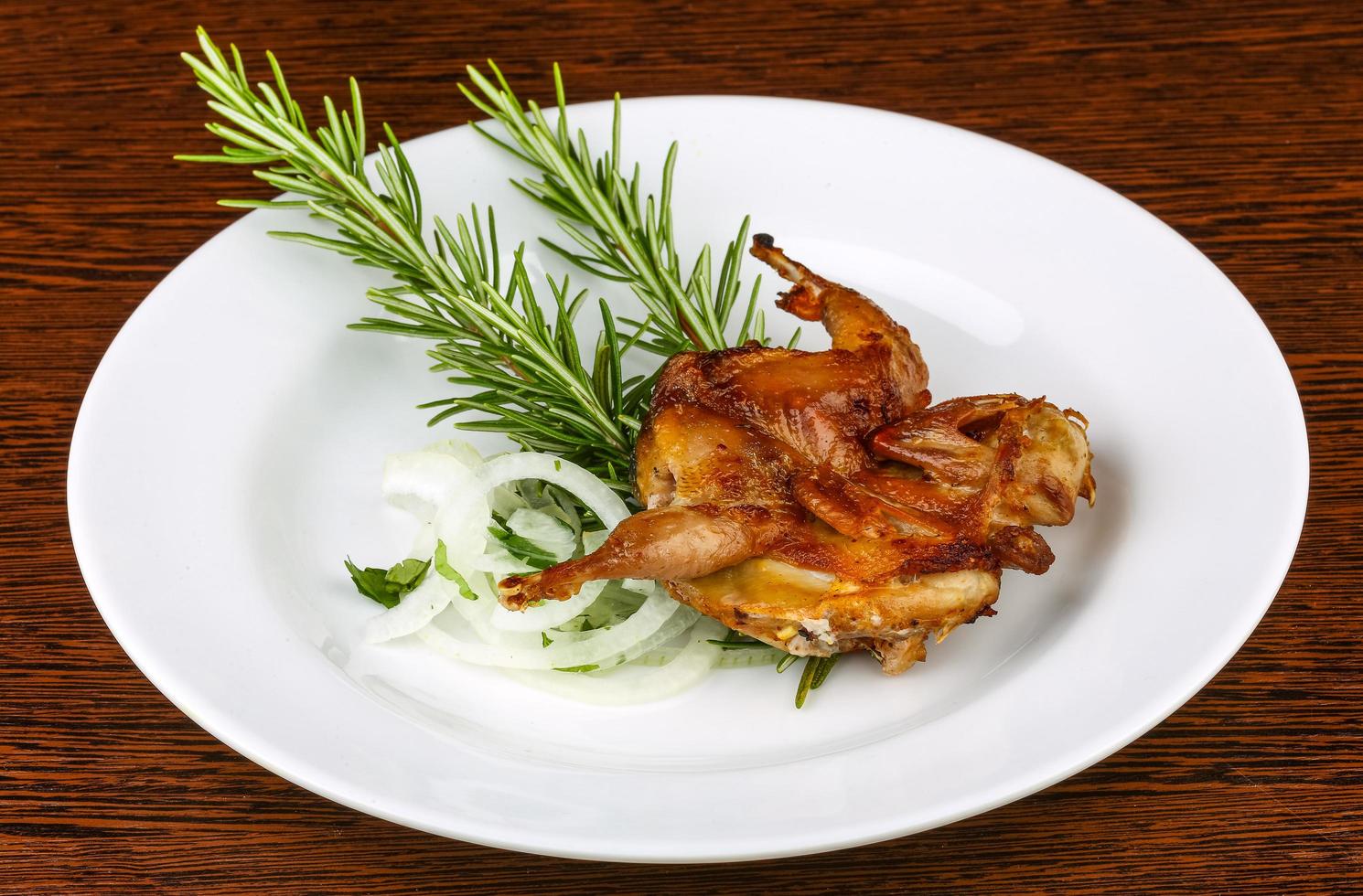 Grilled quail on wood photo