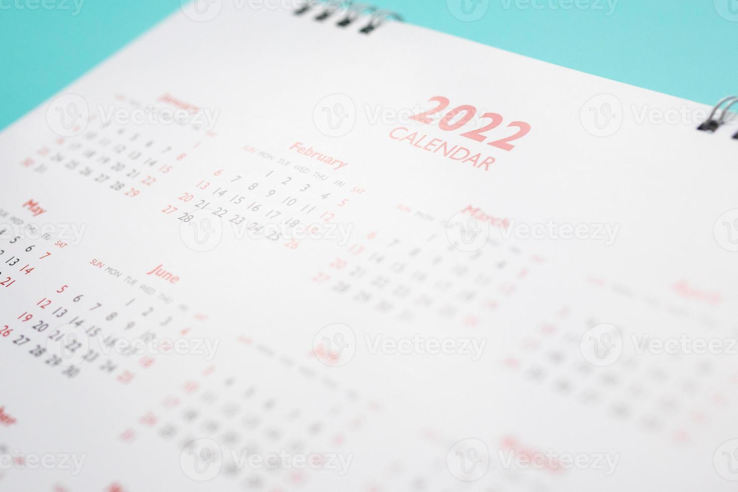 2022 calendar page on blue background business planning appointment meeting concept photo