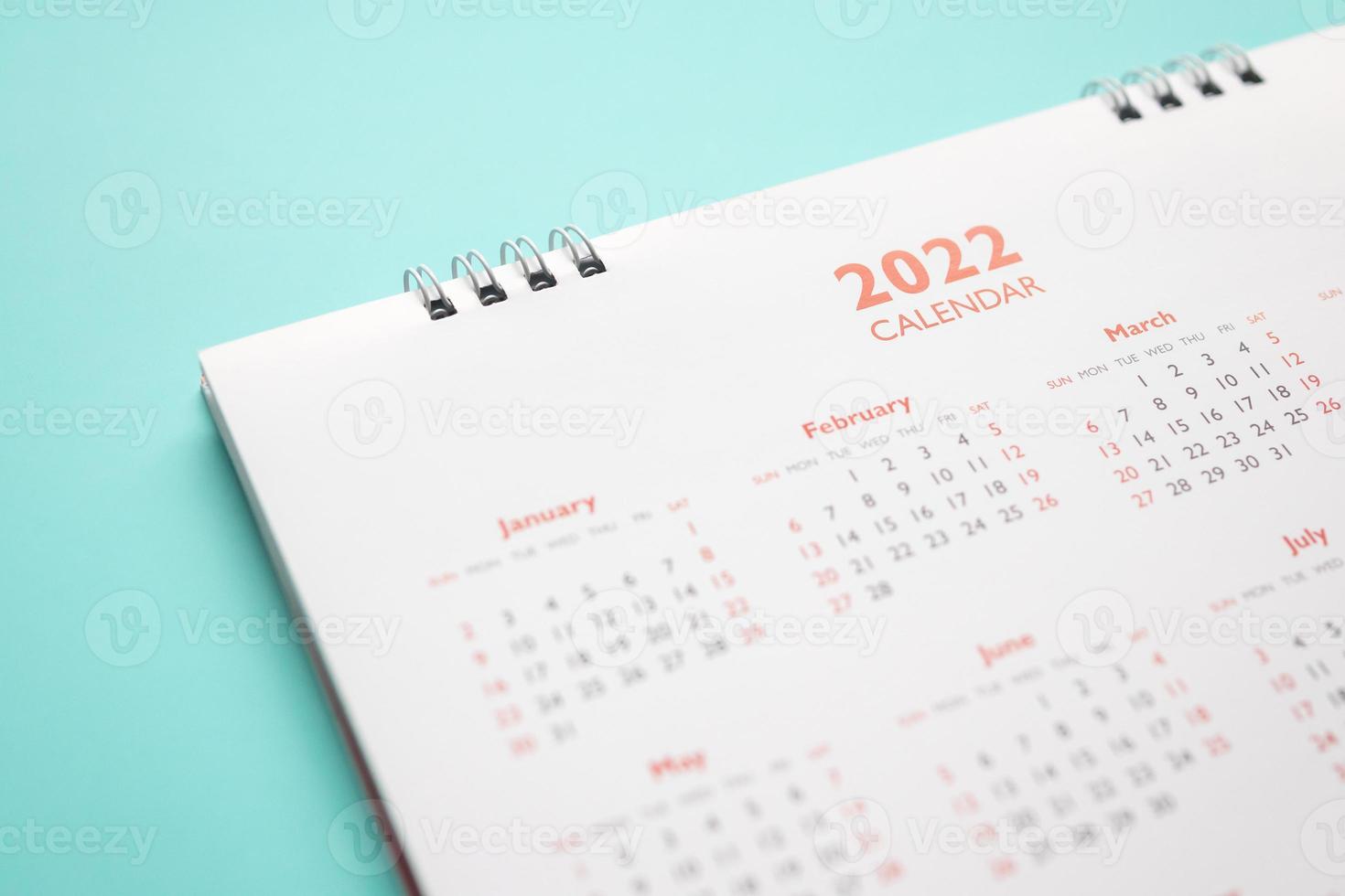 2022 calendar page on blue background business planning appointment meeting concept photo