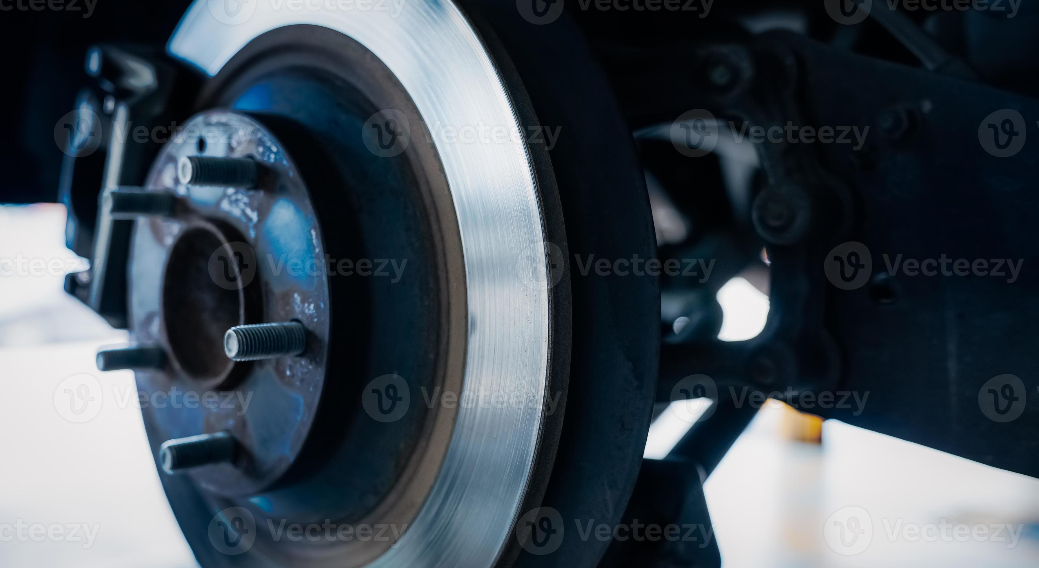 Car disc brake system. Car suspension in process of new tire