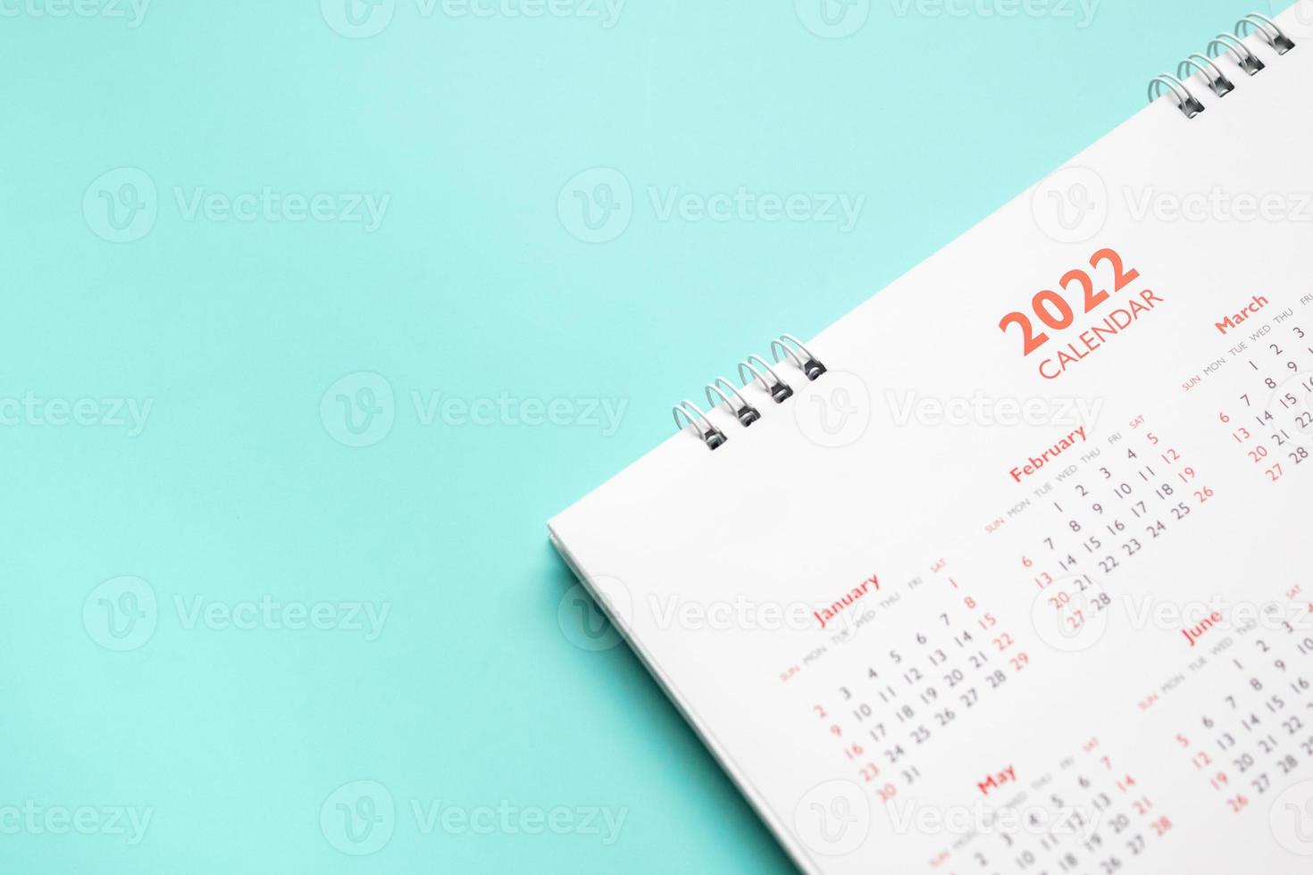 2022 calendar page on blue background business planning appointment meeting concept photo