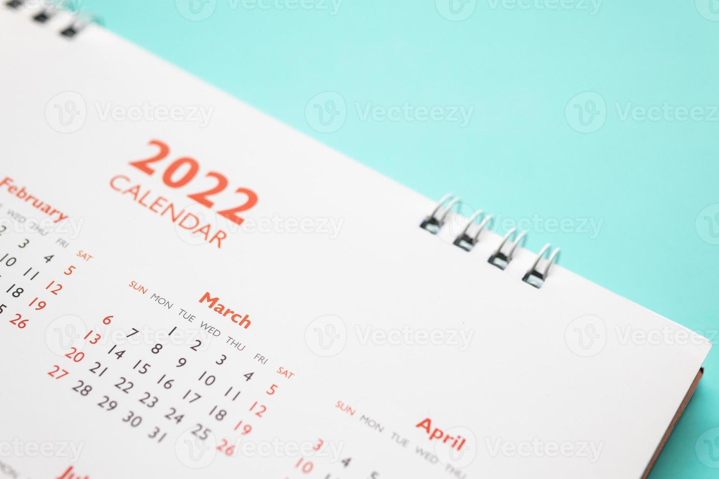 2022 calendar page on blue background business planning appointment meeting concept photo