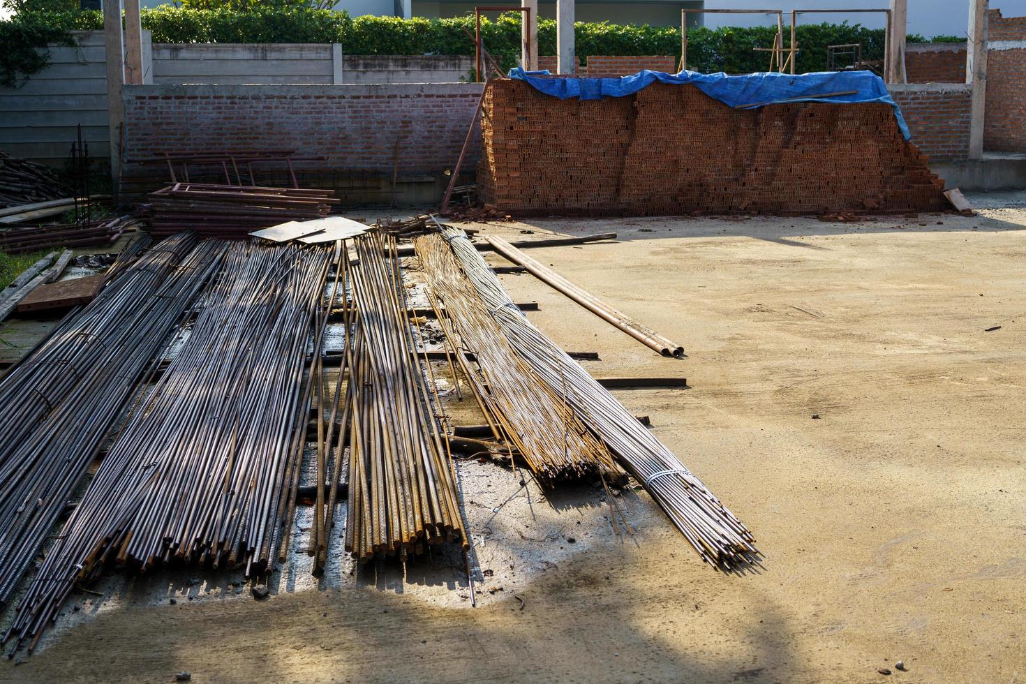 Brick block rebar on cement floor for house construction preparation photo