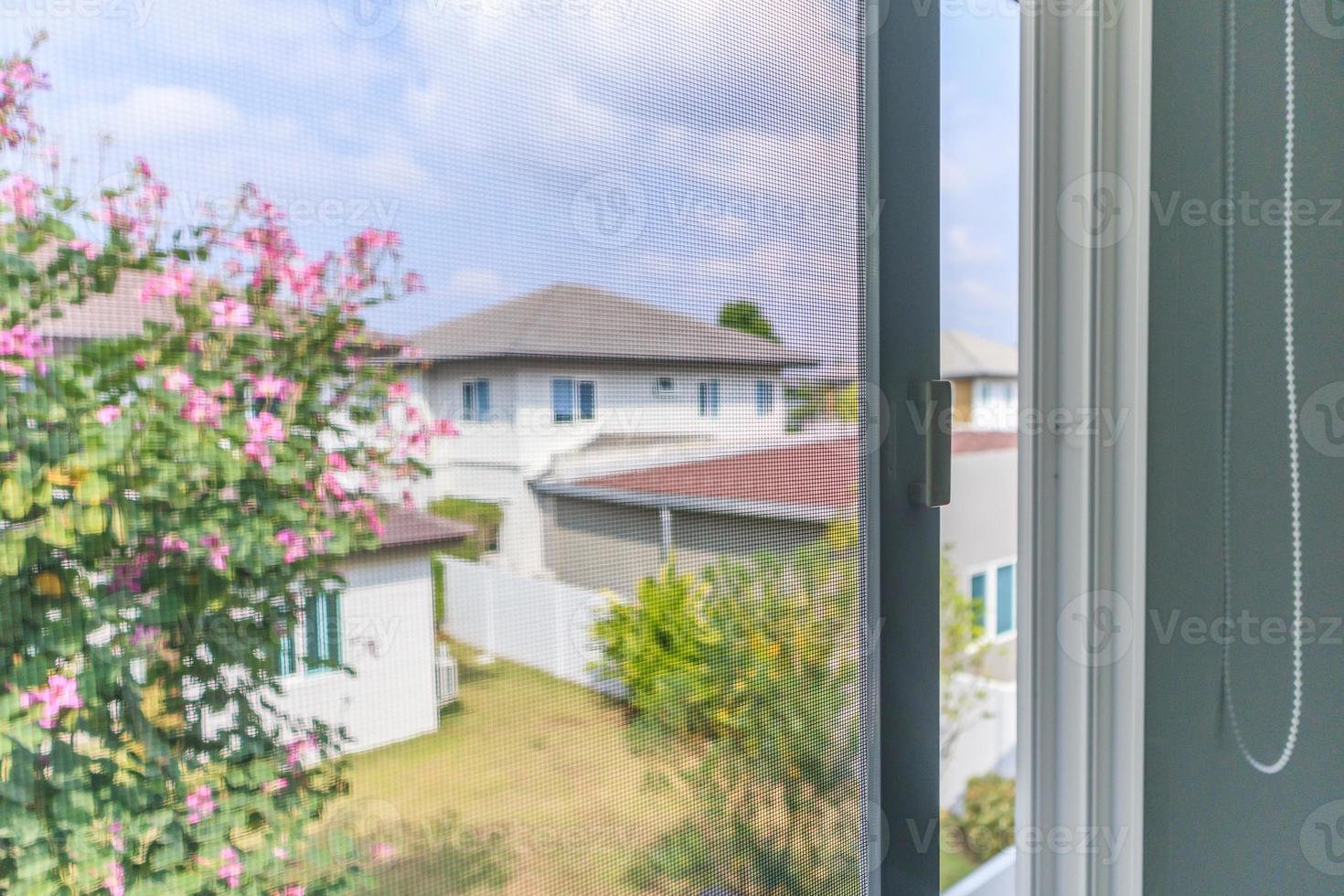 mosquito net wire screen on house window protection against insect photo
