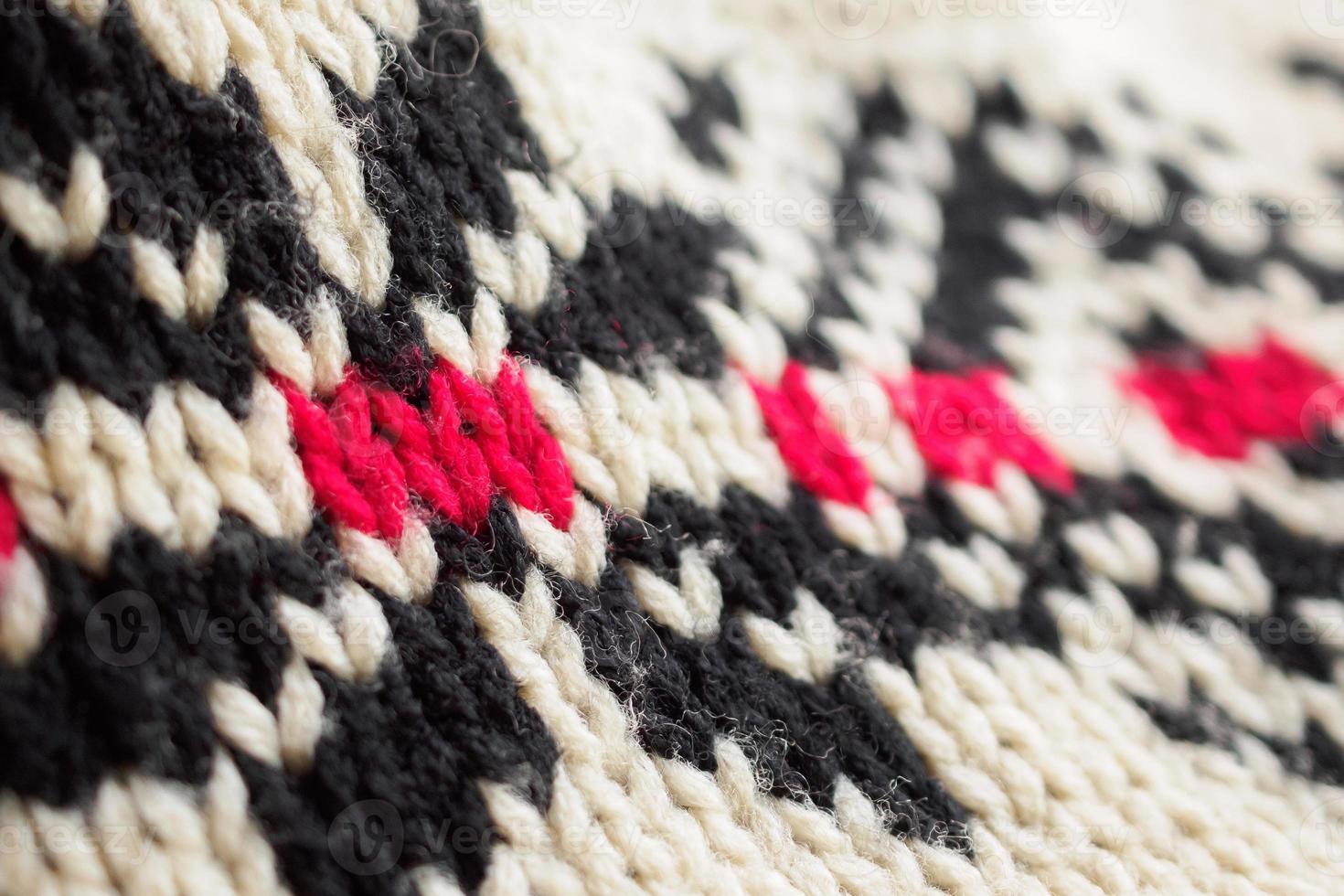 close up of knitted woolen fabric texture background photo